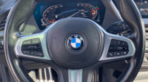 Volant BMW Série 1 grise – finition M Sport d'une voiture compacte d'occasion à Narbonne / voiture occasion Narbonne